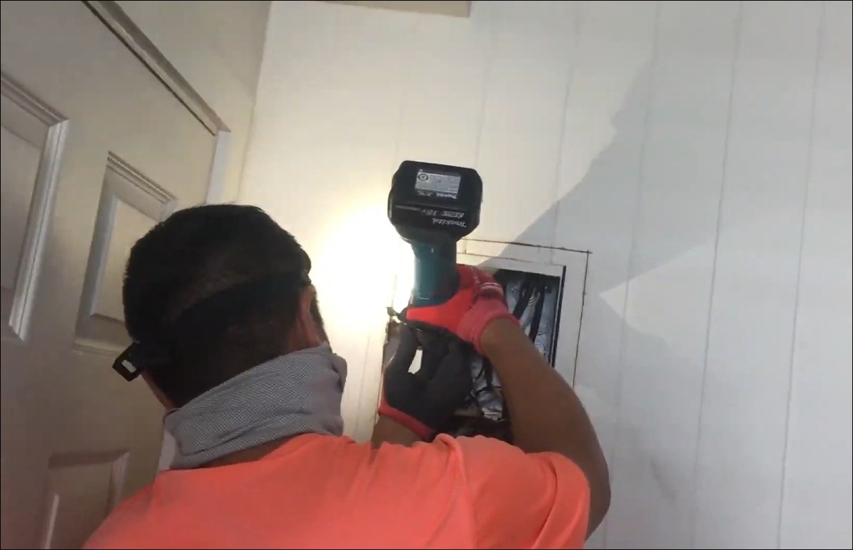 JM Electric technician performing residential electrical installation